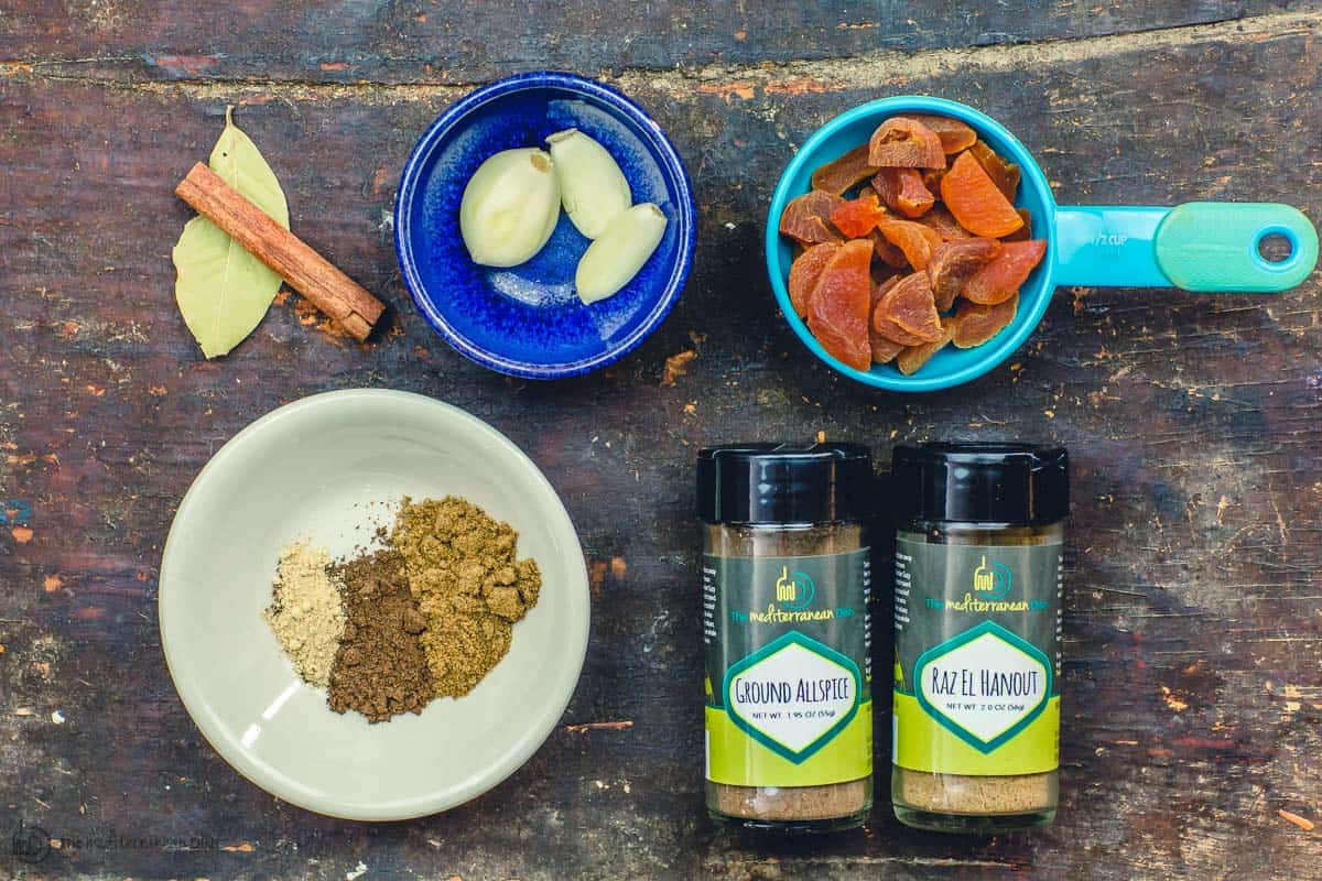 Spices, garlic, dried apricots, bay leaves and cinnamon for lamb stew