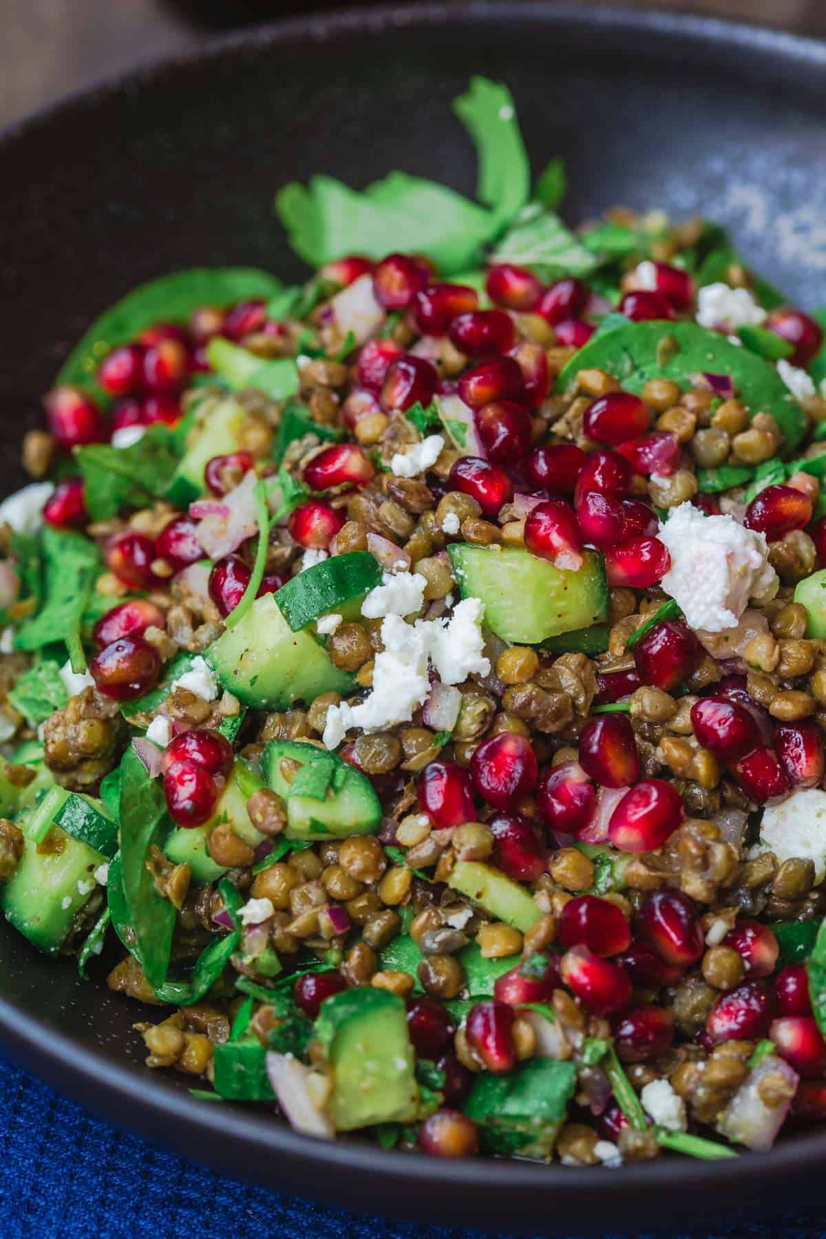 Lentil salad with pomegranates, feta cheese and vegetables