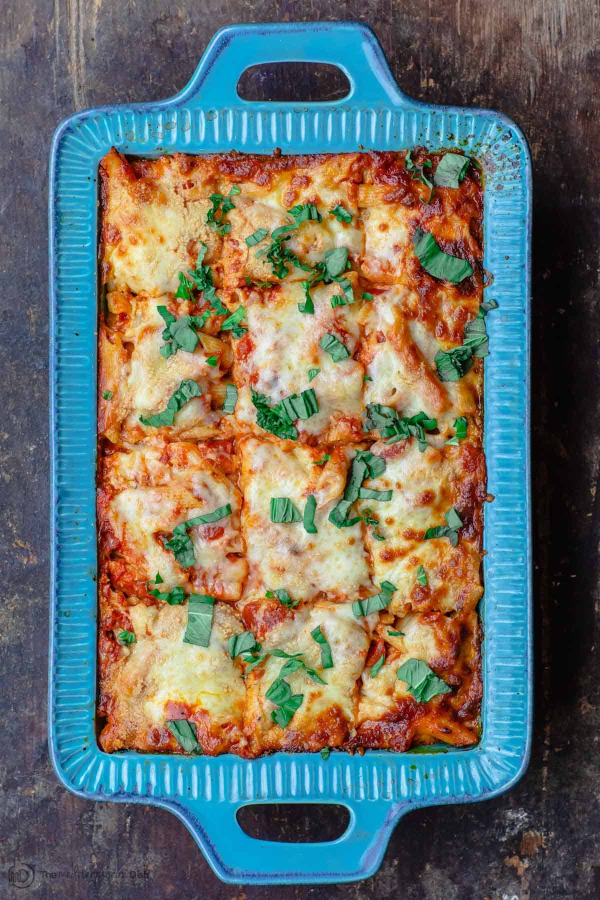 Vegetarian Baked Ziti with Ricotta. Garnished with basil