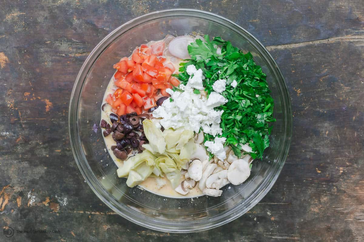 Ingredients for egg casserole in mixing bowl