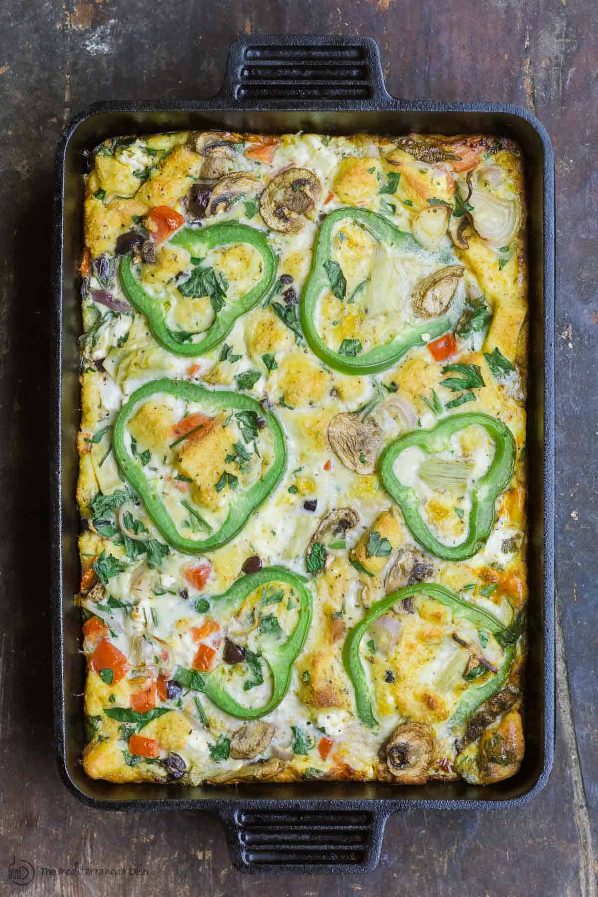 Egg casserole with vegetables in baking pan