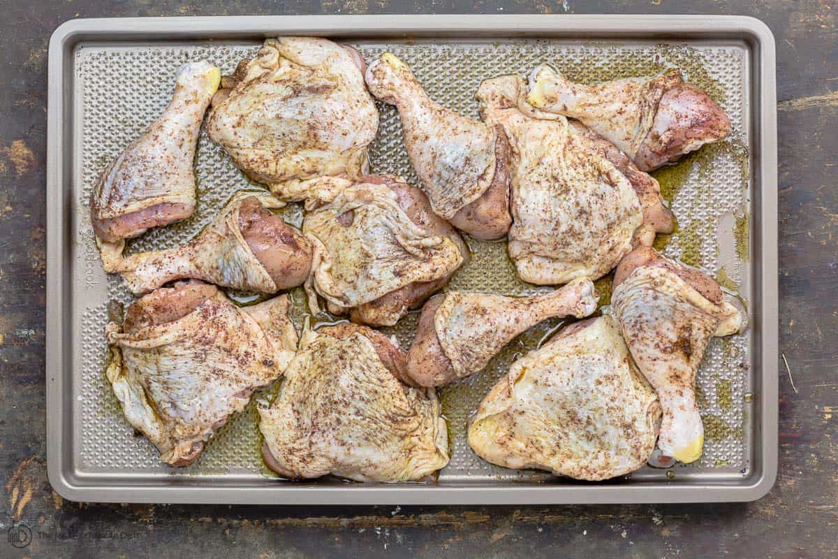 Chicken pieces that have been seasoned with salt and spice mixture for musakhan