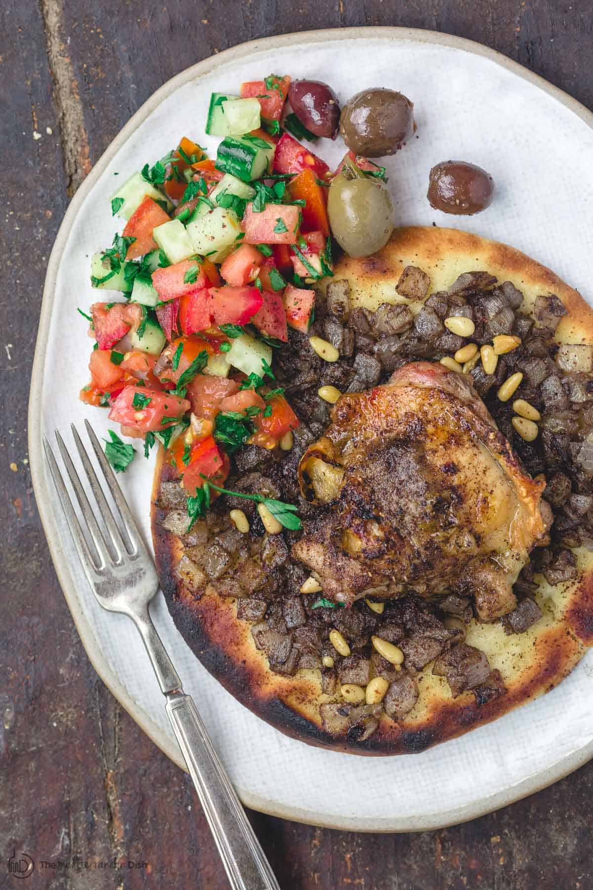 Musakhan sumac chicken assembled and served with salad