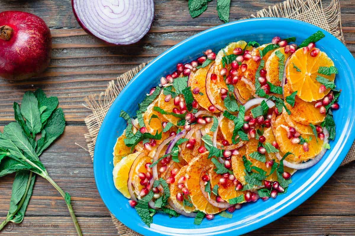 Orange salad. Onion and pomegranate to the side of a large platter