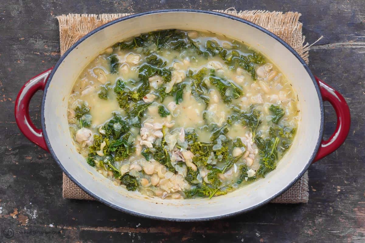 White bean and Kale Soup with chicken in the pot