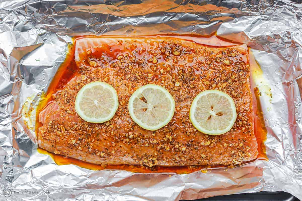 Salmon placed in foil lined baking sheet