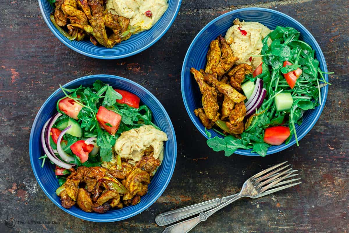 three bowls of chicken shawarma salad