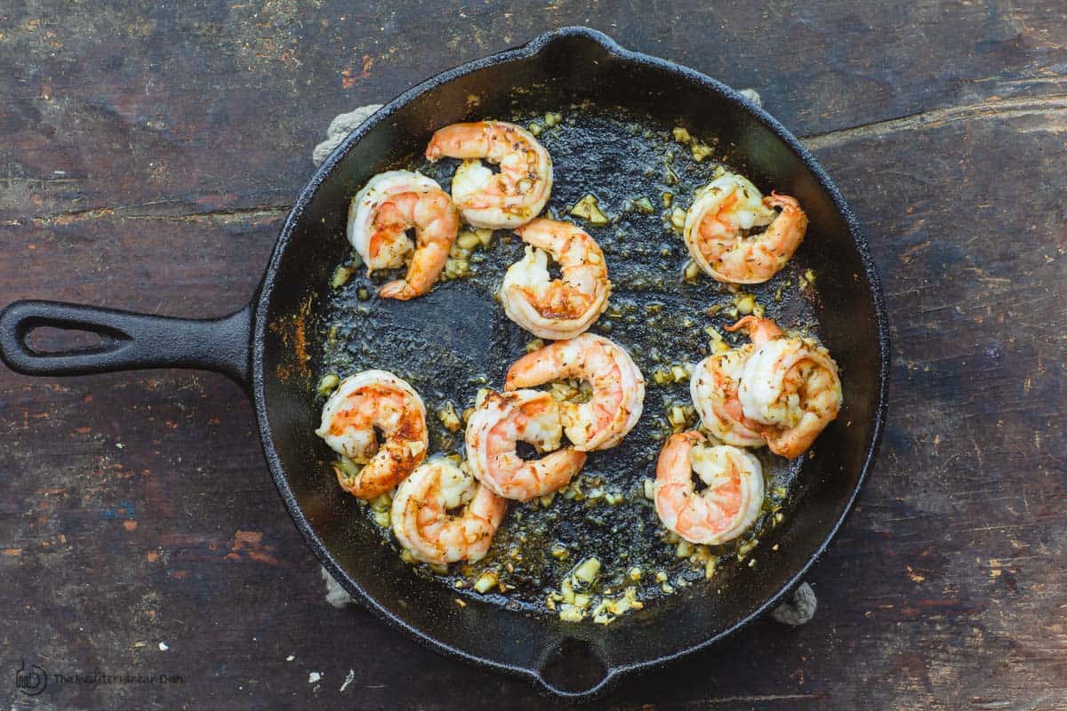 Shrimp sauteed in skillet with garlic and olive oil