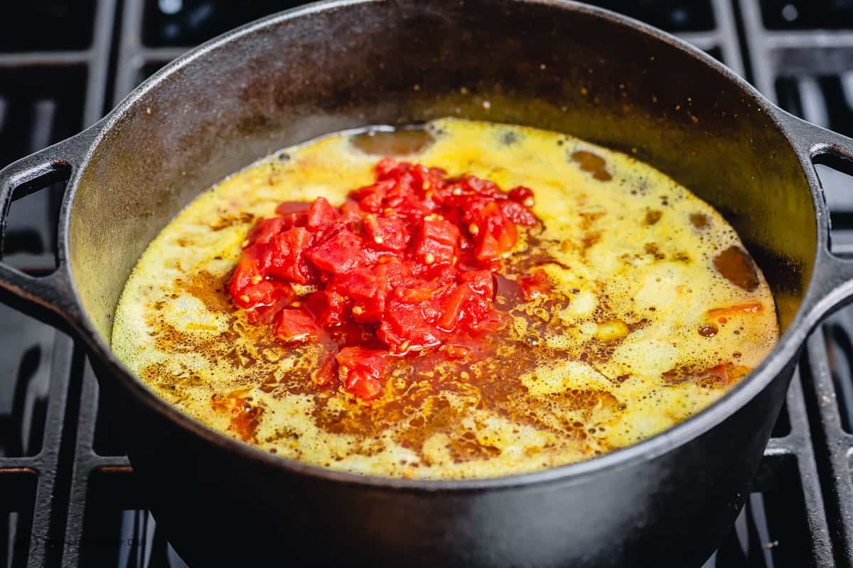 broth and tomatoes are added