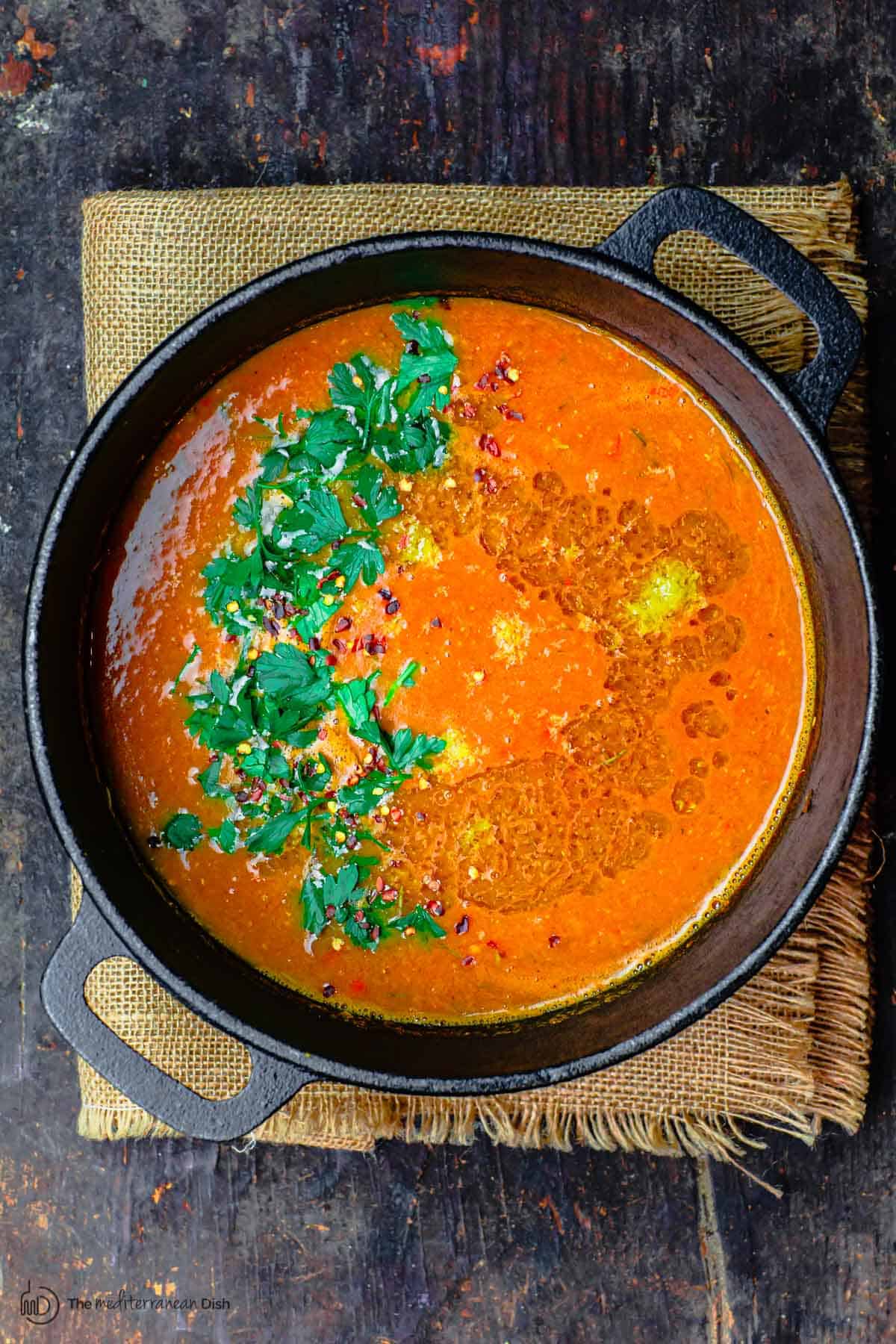 Red lentil soup finished with lemon zest and parsley