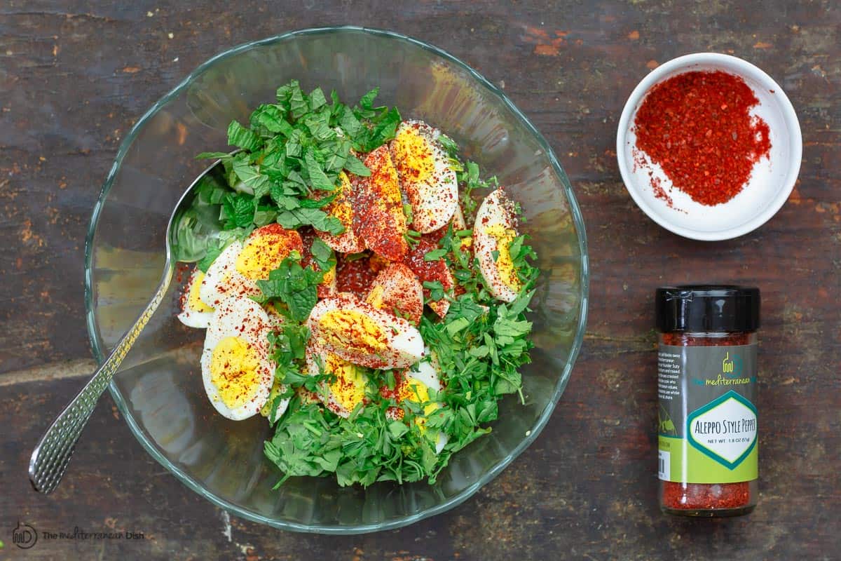 Eggs mixed with spices, olive oil and fresh herbs