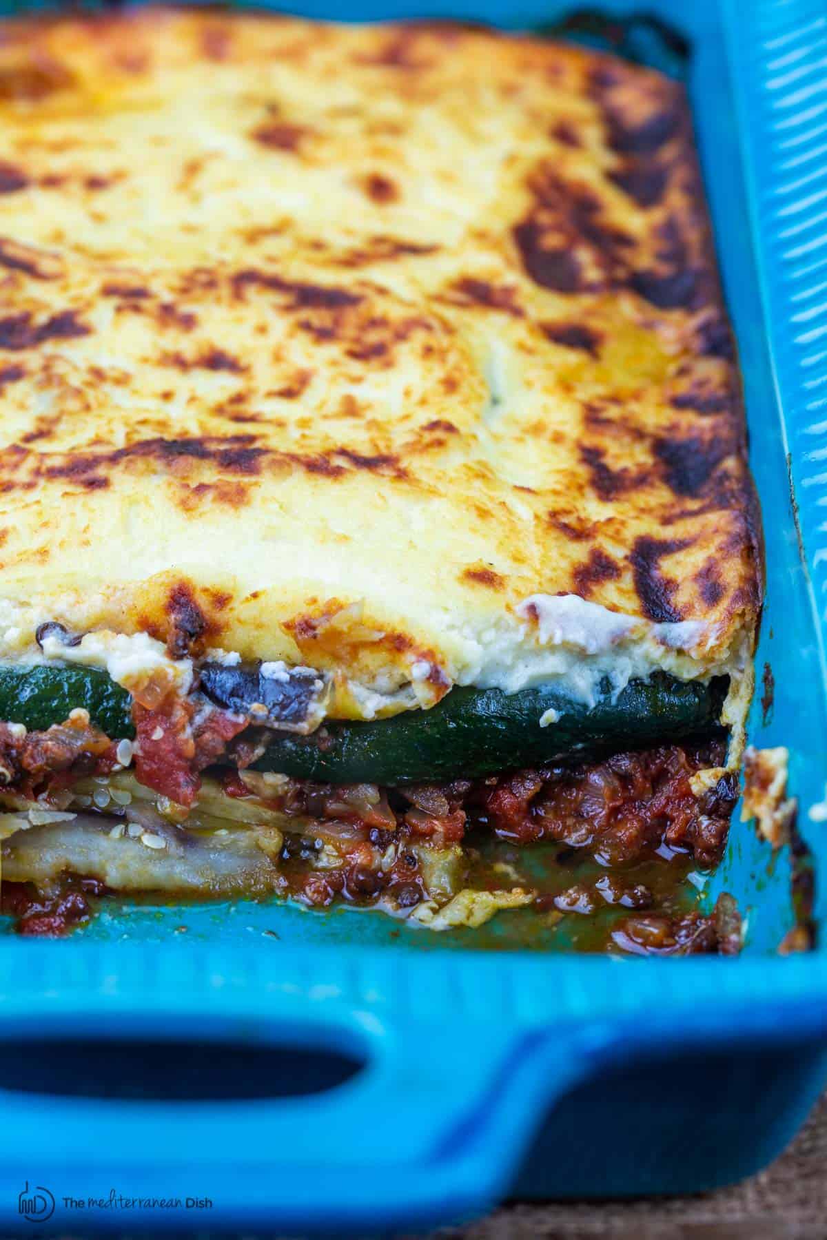 Vegetarian moussaka in blue baking dish