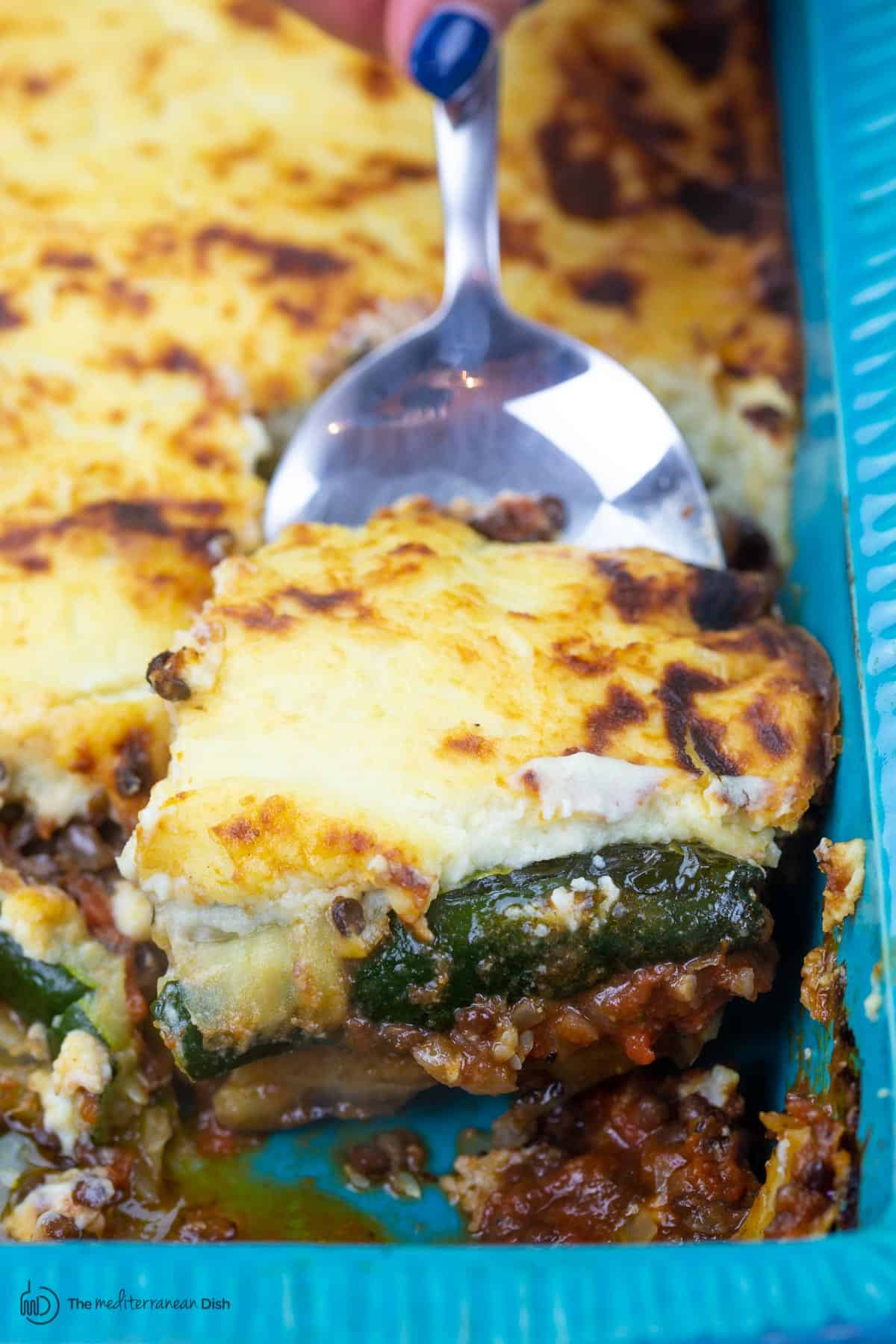 Vegetarian moussaka with eggplant, potatoes, zucchini and bechamel on top