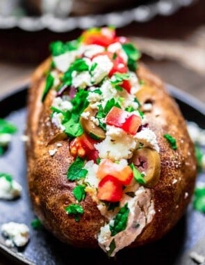 Loaded baked potato with Mediterranean toppings