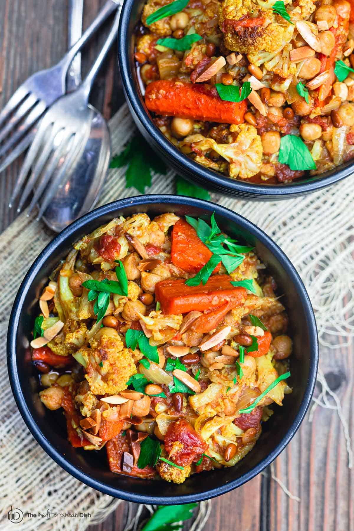 chickpea stew with cauliflower and carrots, served in dinner bowls