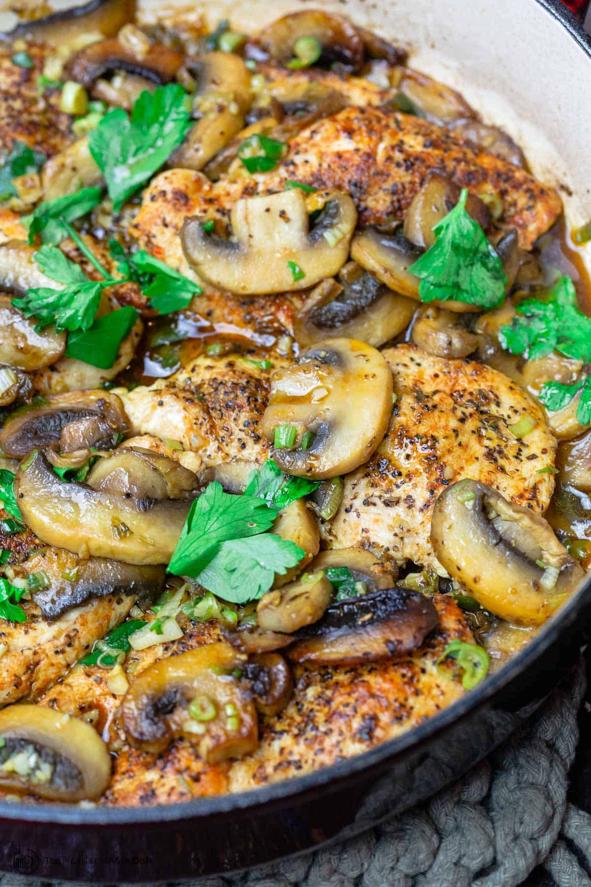 Chicken and mushrooms garnished with parsley