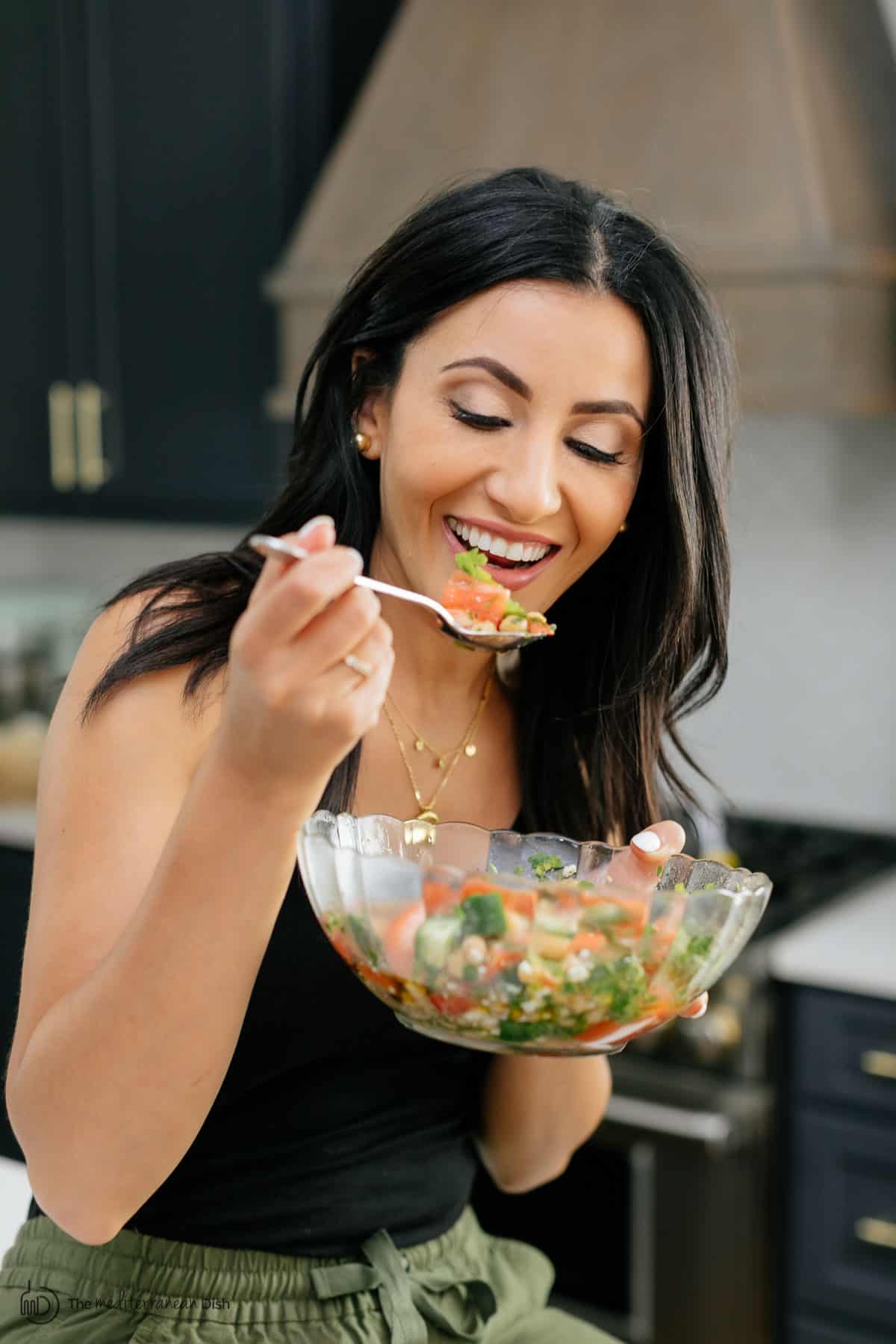 Suzy Karadsheh of The Mediterranean Dish enjoying her favorite chickpea salad