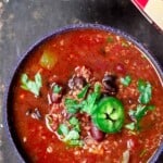 Vegan chili in a bowl with quinoa and jalapenos