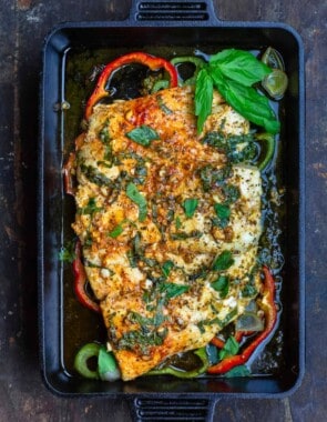Marinated baked fish with garlic, basil, and bell peppers