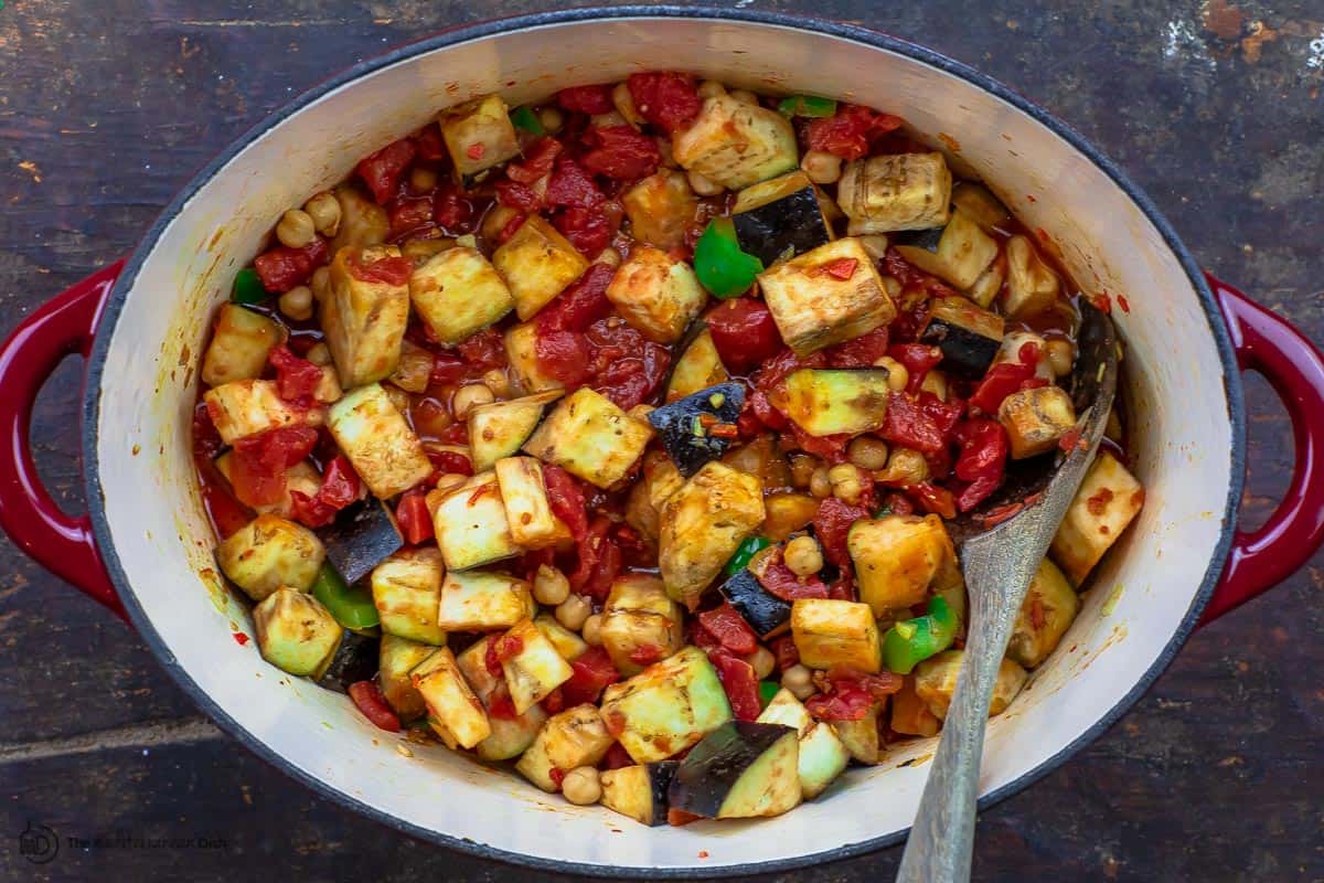 eggplant, chickpeas and tomatoes added to the pot