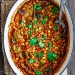 Eggplant stew with chickpeas and tomatoes in Dutch oven