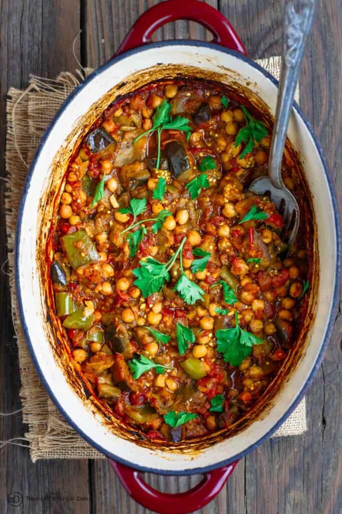 Eggplant stew with chickpeas and tomatoes in Dutch oven