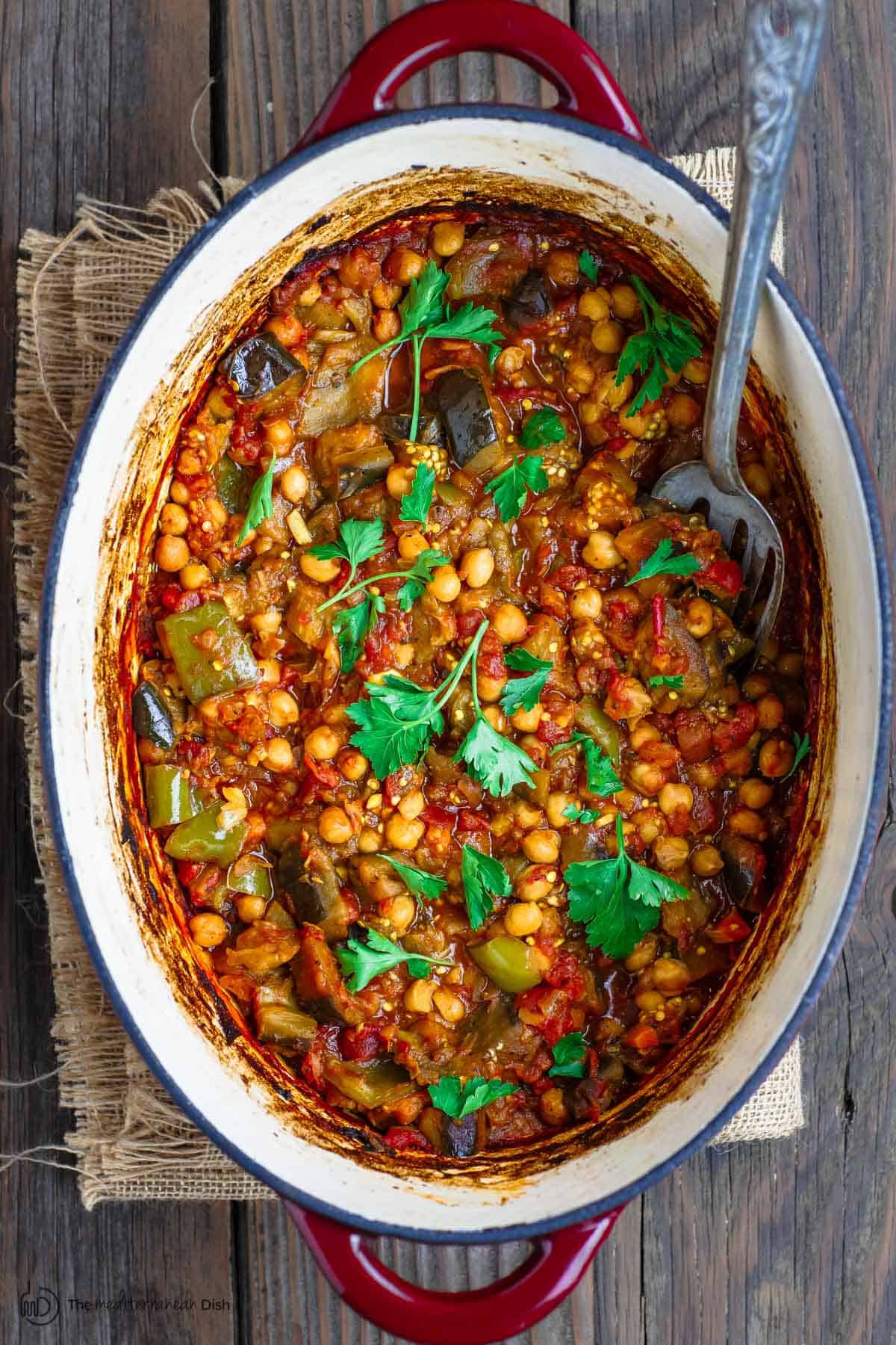 Eggplant stew with chickpeas and tomatoes in Dutch oven