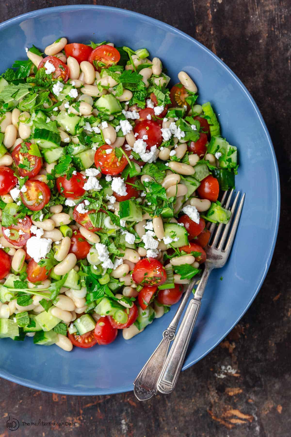 White bean salad topped with feta cheese. Ready to serve