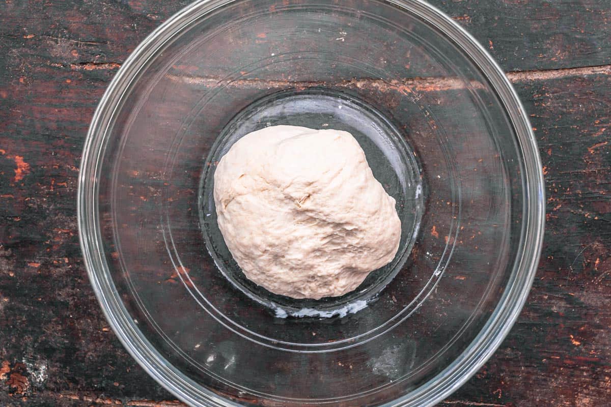 kneaded dough in a clean mixing bowl before rising