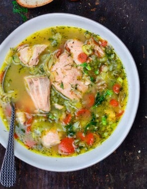 Salmon soup in a bowl. A side of bread