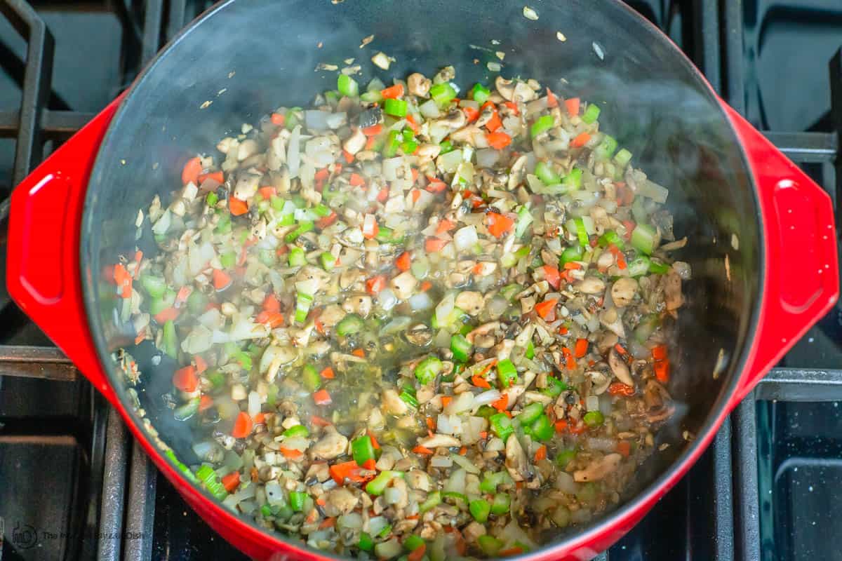 chopped vegetables and mushrooms cooked in pot