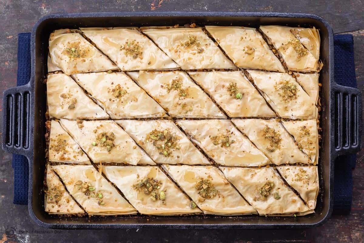 Baklava with honey syrup and crushed pistachio garnish