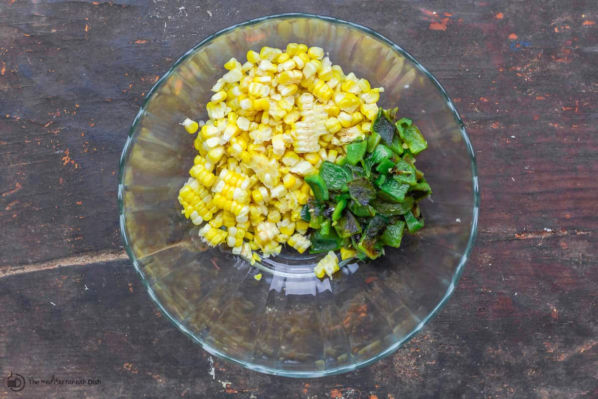 chopped pablano added to the bowl with the corn