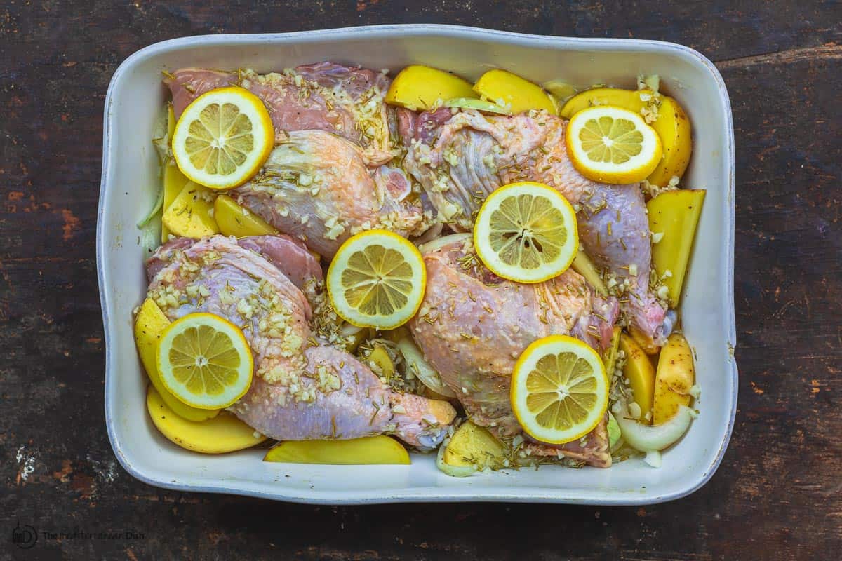 chicken and sauce added to the baking pan