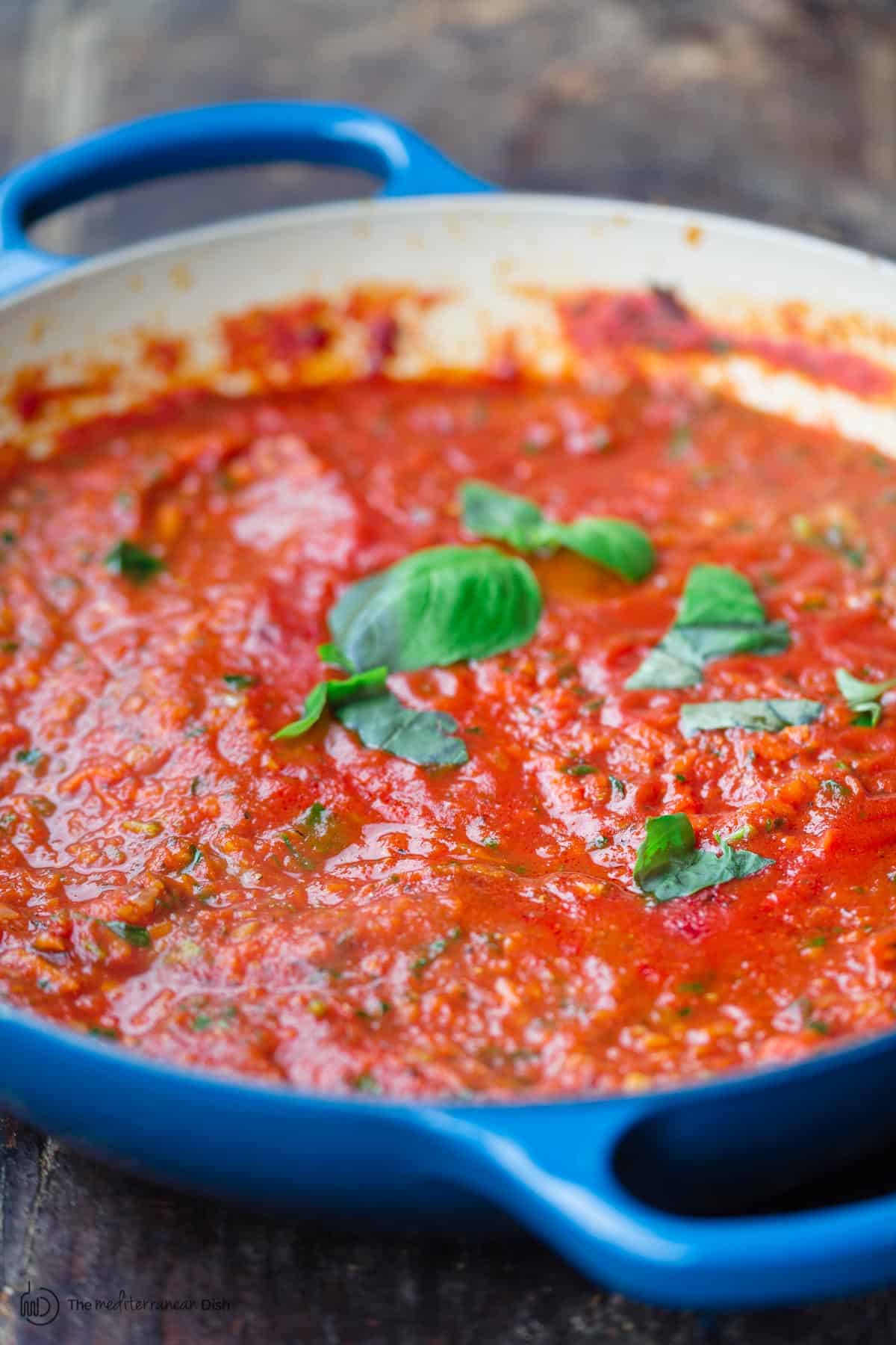 Homemade spaghetti sauce topped with basil