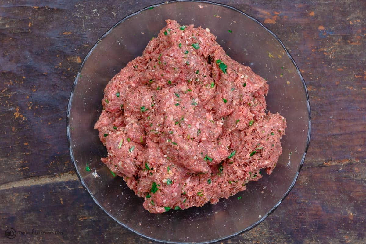 Meat mixture for meatballs in a mixing bowl