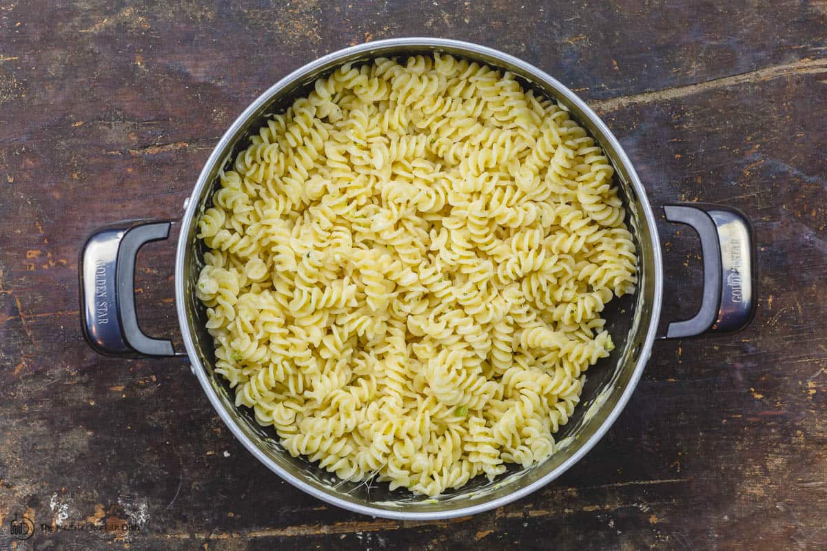 Cooked pasta tossed with Parmesan cheese in the pot