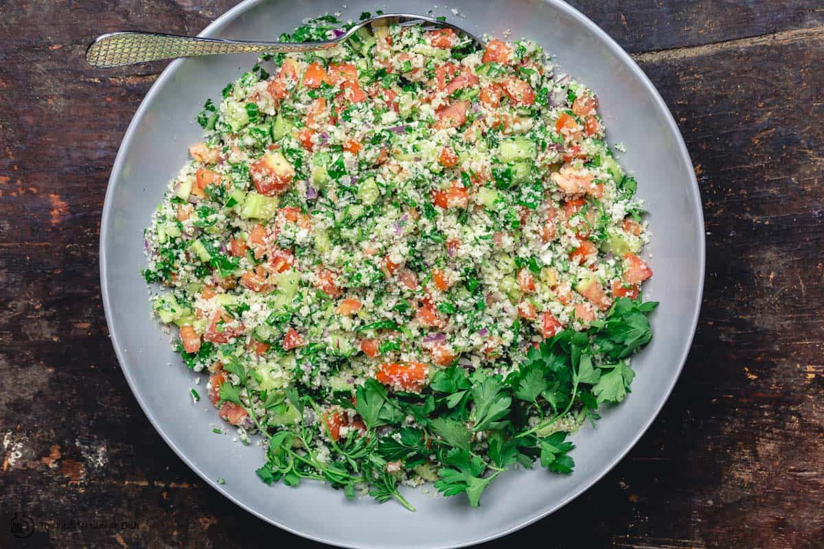 Healthy cauliflower salad, mixed and ready for serving