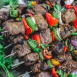 Steak kabobs with bell peppers and onions served on platter