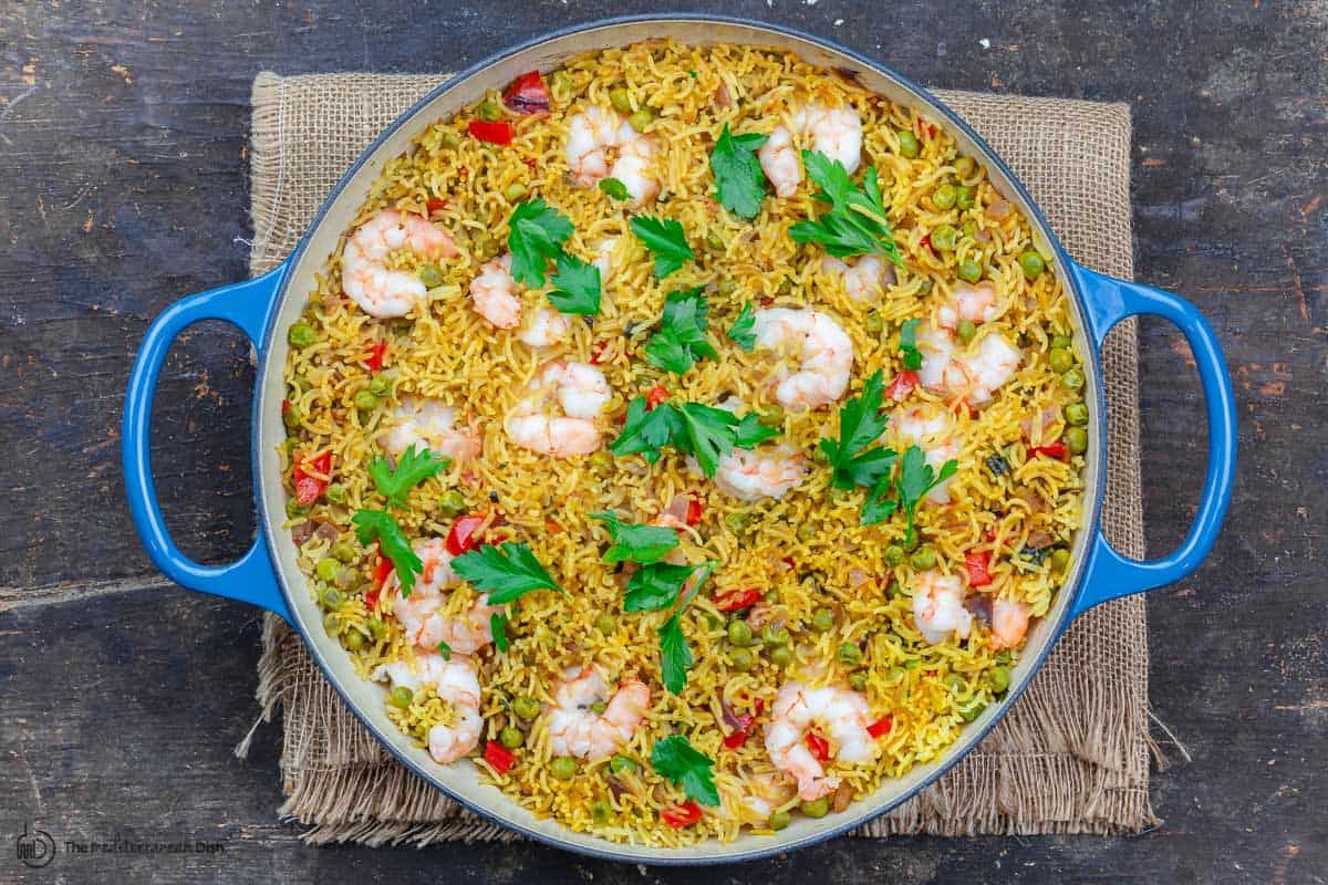 Garnish of parsley is added to this healthy shrimp and rice recipe before serving