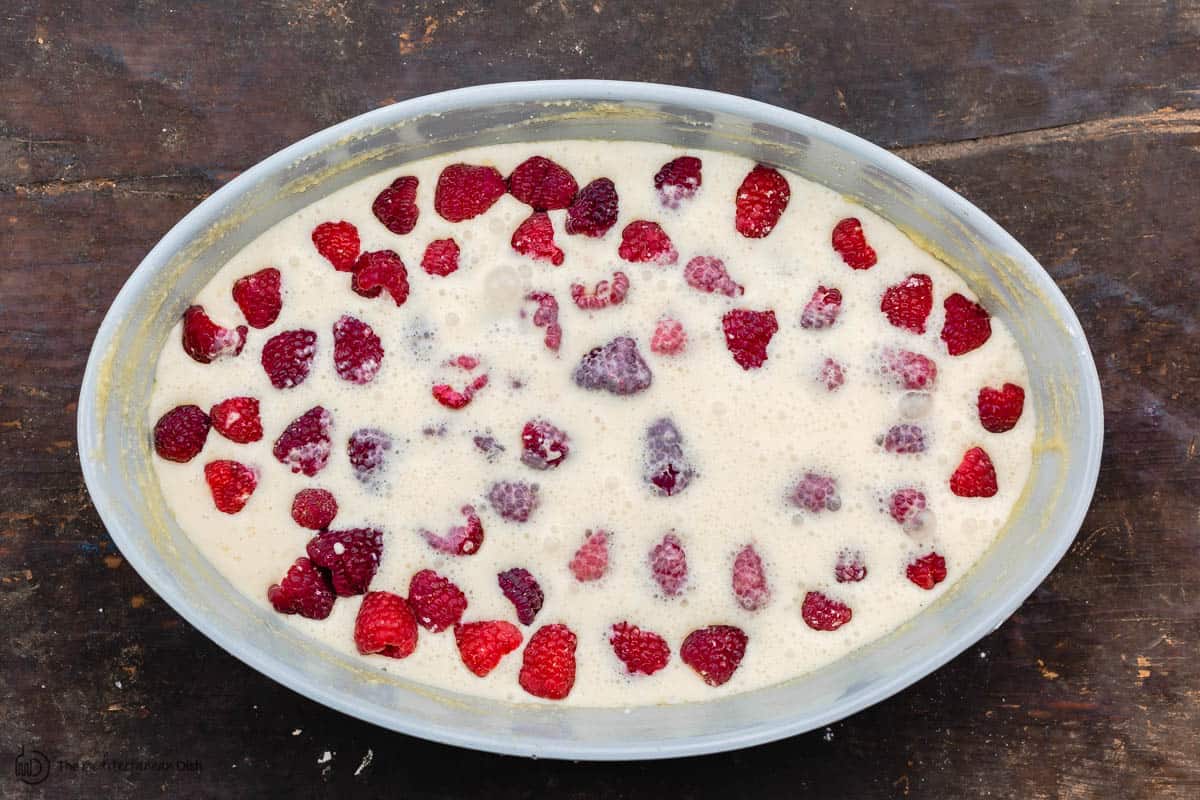 batter poured over the raspberries