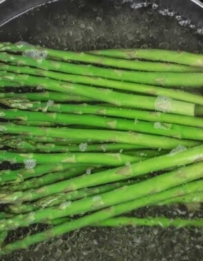 Asparagus cooking in boiling water.