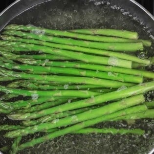 Asparagus cooking in boiling water.