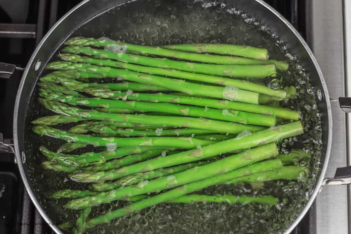 Asparagus cooking in boiling water.