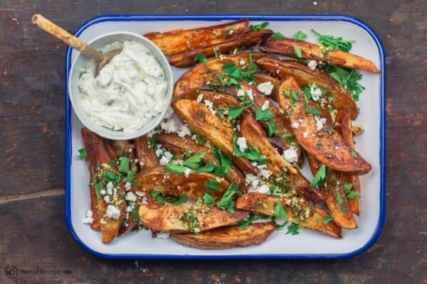 Greek baked fries (wedges) served with tzatziki sauce