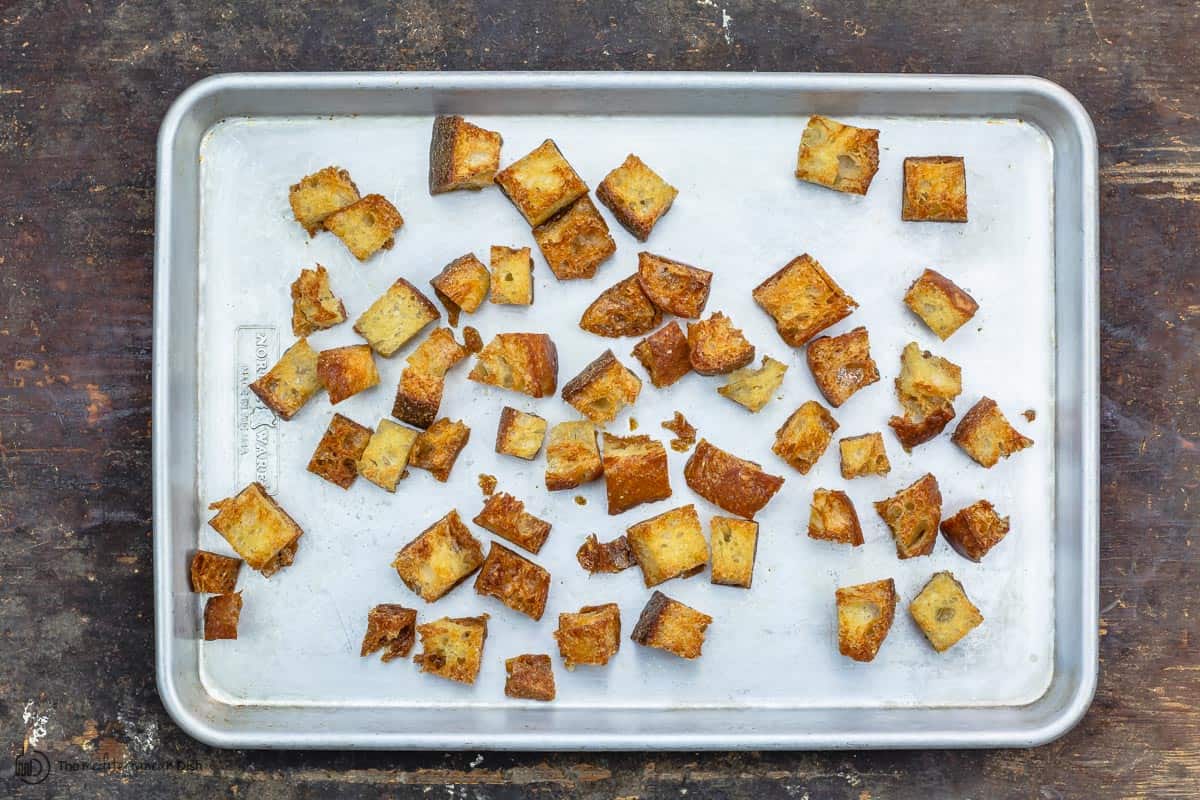 Bread cubes toasted in the pan