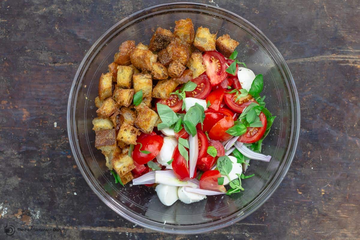 panzanella ingredients in a large mixing bowl