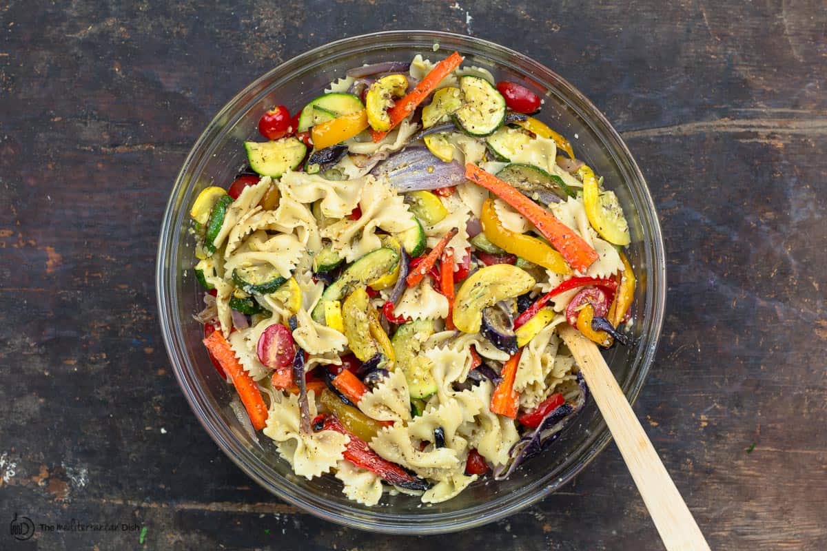 roasted vegetables and pasta tossed in a bowl
