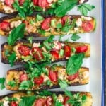 vegetarian zucchini boats assembled on serving platter