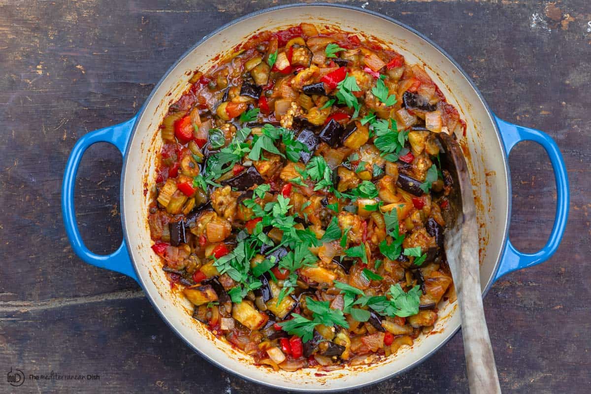 finished caponata, garnished with parsley and mint